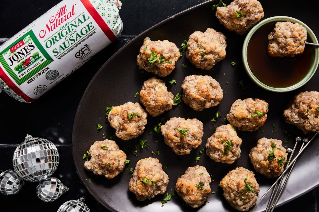 Platter of sausage balls with hot honey sauce for dipping and jones dairy farm sausage package