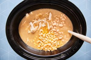 Adding corn and chicken to slow cooker
