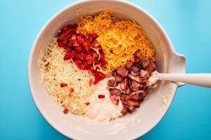 Ingredients for hot pimento dip in a bowl before mixing