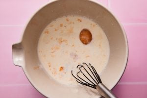 Eggs and cream being whisked together