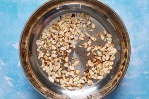 almonds toasting in a skillet