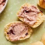 cranberry honey butter spread on a roll