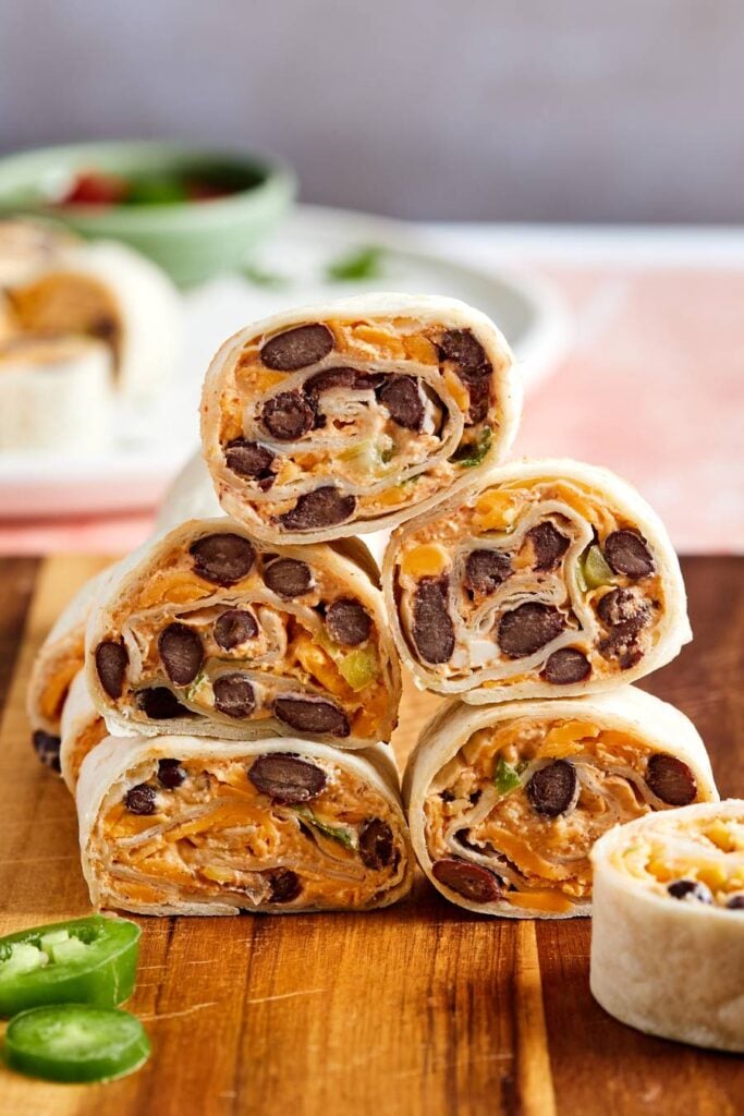 Stack of taco tortilla pinwheels on a cutting board
